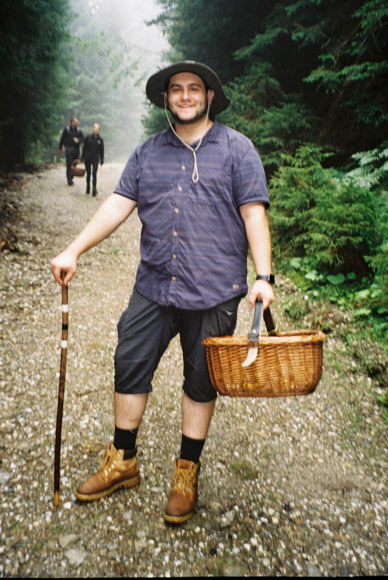 Simone on a forest path carrying a basket