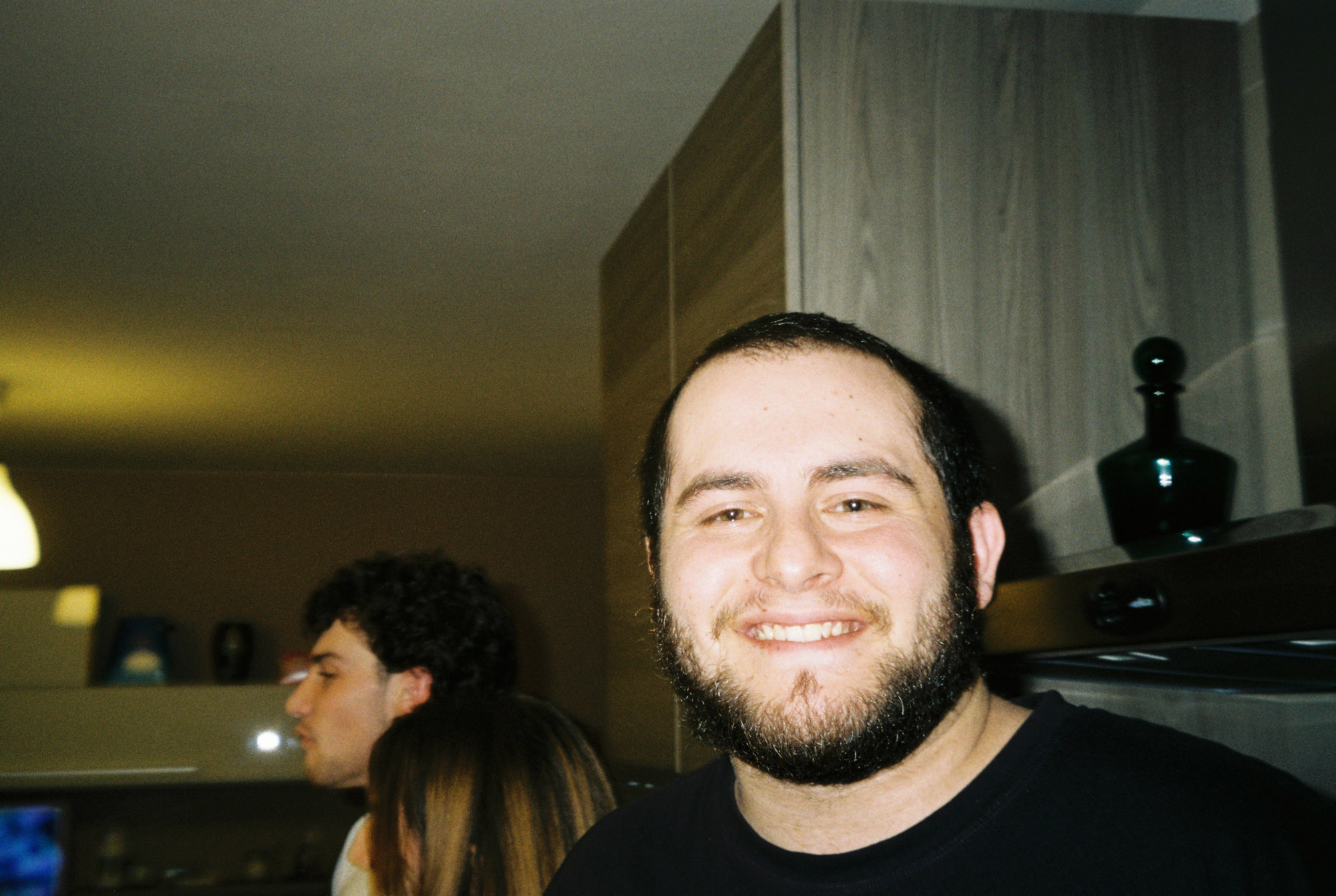 Simone smiling indoors